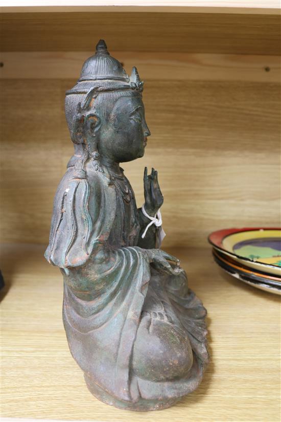 A Chinese bronze seated figure of a Buddha 29cm